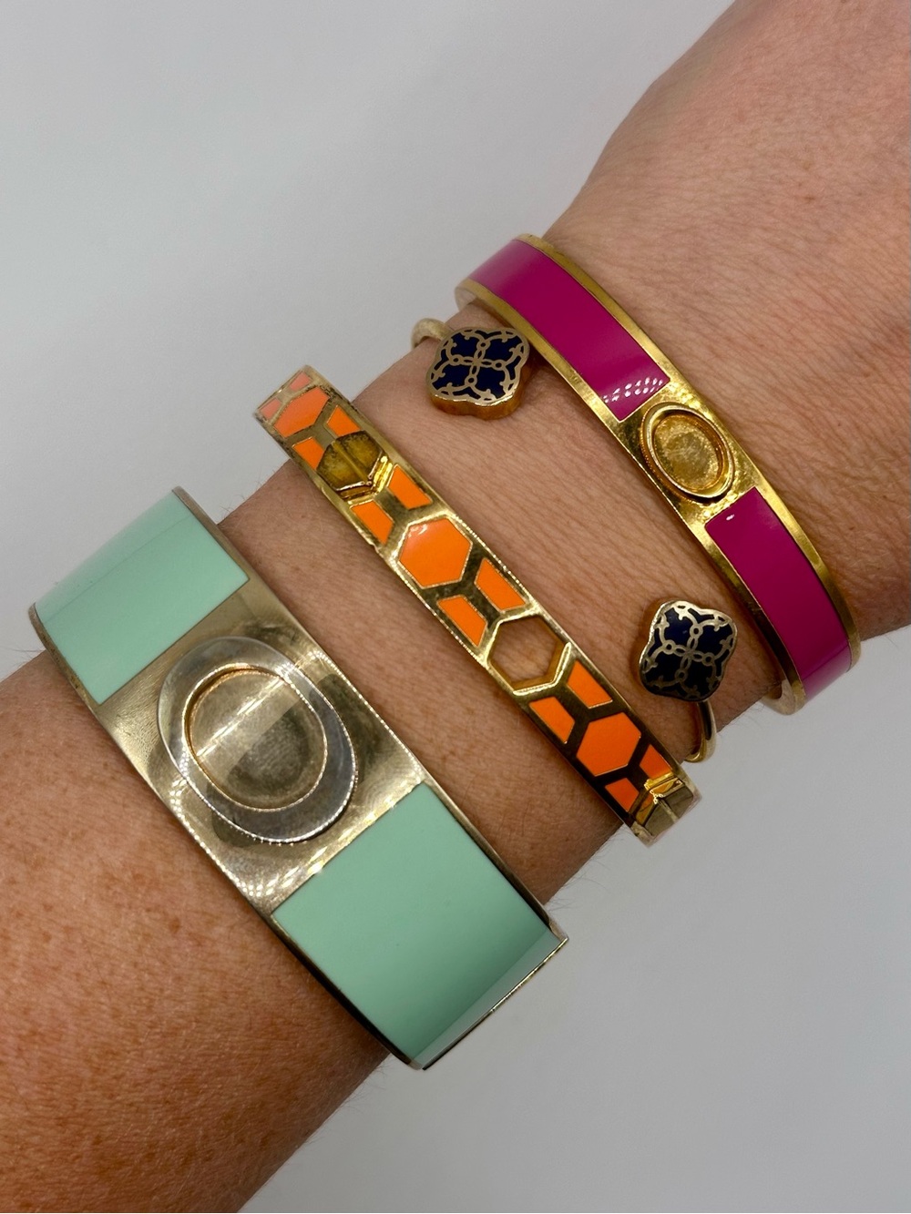 C. Wonder Bracelet Set - 4 Gold Tone and Enamel Colorful Bangles Cuff Bracelets